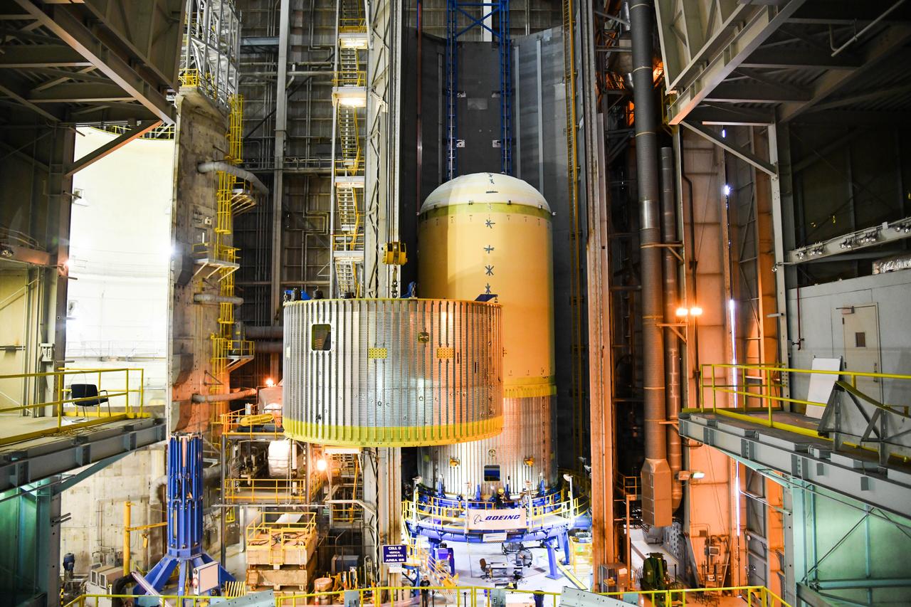 The Space Launch System (SLS) rocket’s liquid oxygen tank structural test article was manufactured and stacked in June 2019 at NASA’s Michoud Assembly Facility in New Orleans. To construct the test article, Boeing technicians at Michoud moved the liquid oxygen tank to the Vertical Assemby Building stacking and integration area. Here, they added simulators to mimic the two structures that connect to the tank, the intertank and the forward skirt.  This structural hardware for the SLS core stage for America’s new deep space rocket is structurally identical to the flight version of the tank. It will be shipped on the Pegasus barge to NASA’s Marshall Space Flight Center in Hunstville, Alabama, where it will undergo a series of tests that simulate the stresses and loads of liftoff and flight. These tests will help ensure designs are adequate for successful SLS missions to the Moon and beyond. The flight liquid oxygen tank along with the liquid hydrogen tank supplies more than 500,000 gallons of propellant to the core stages four RS-25 engines, which produce 2 million pounds of thrust to help send the SLS rocket to space.